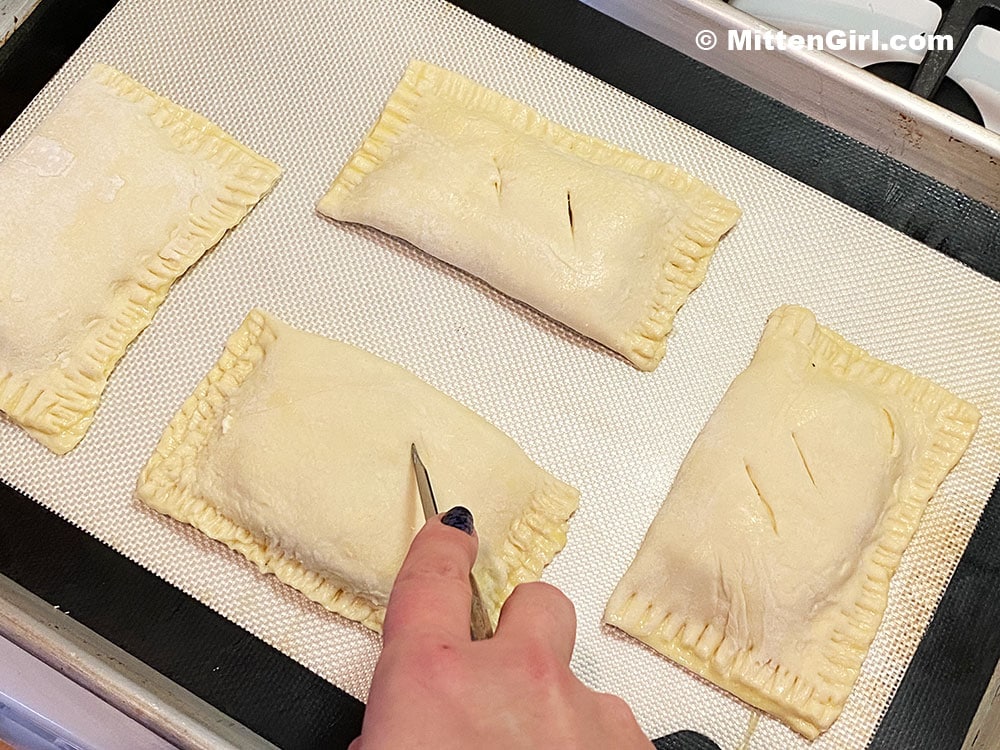 Cut slits into the pastry to vent the steam